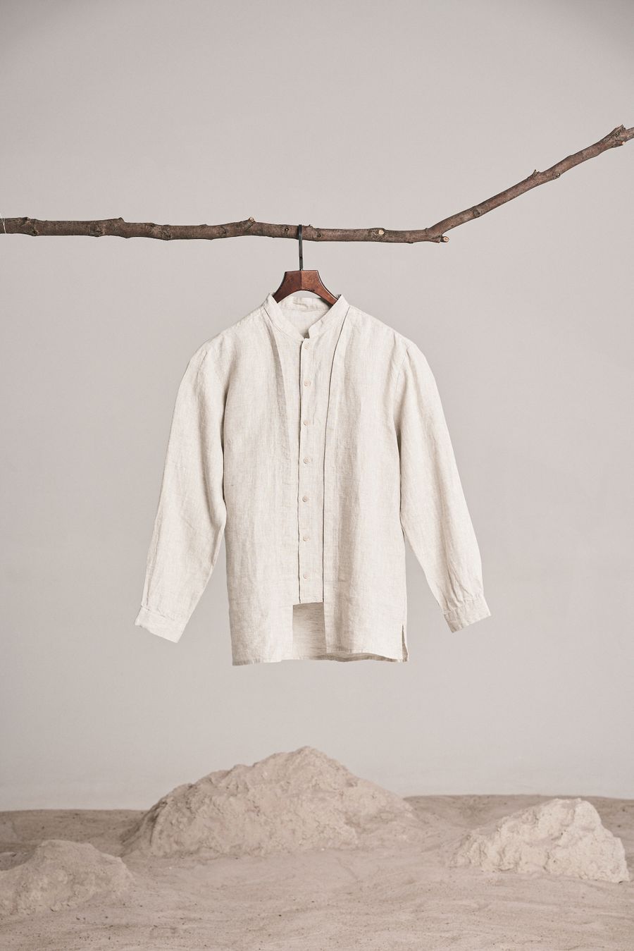 The same linen shirt hanging outdoors from a branch